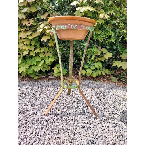 64 - Glazed terracotta bowl raised on metal stand {72 cm H x 52 cm Dia.}.