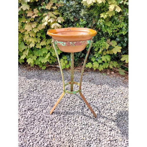 64 - Glazed terracotta bowl raised on metal stand {72 cm H x 52 cm Dia.}.