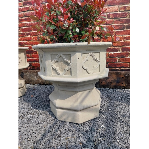 644 - Pair of good quality moulded stone planters in the Gothic style {69 cm H x 71 cm Dia.}.