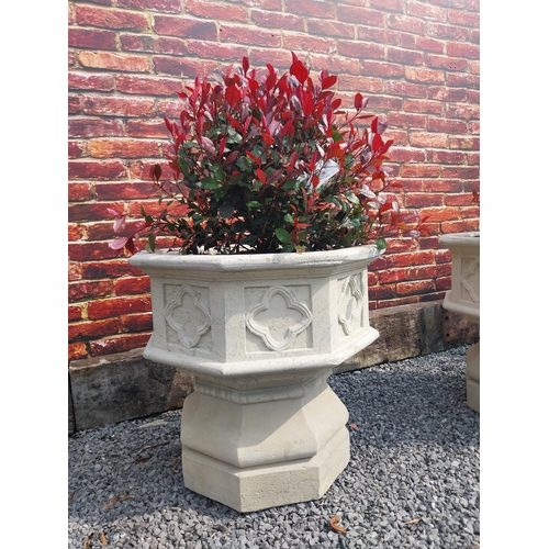 644 - Pair of good quality moulded stone planters in the Gothic style {69 cm H x 71 cm Dia.}.