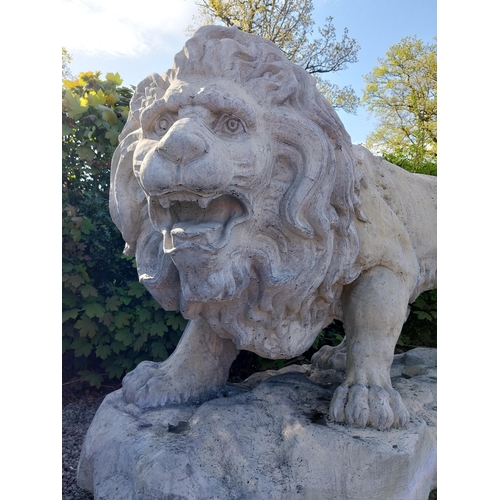 69 - Pair of exceptional quality moulded sandstone majestic Lions {132 cm H x 210 cm W x 80 cm D}.