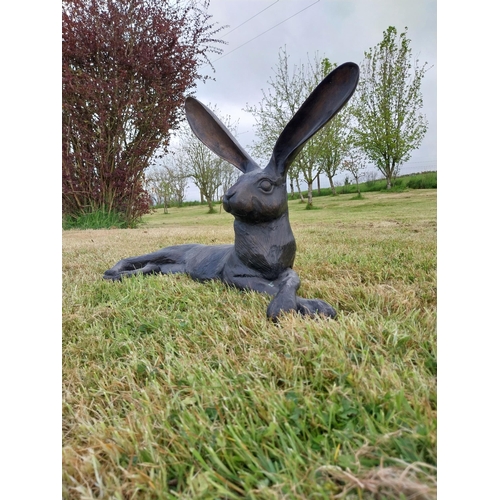 72 - Exceptional quality statue of a lying Hare with ears up  {61 cm H x 35 cm W x 20 cm D}.