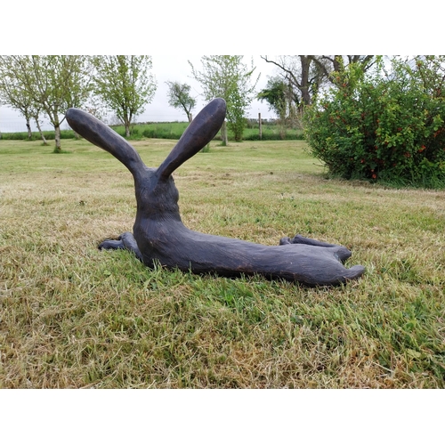 72 - Exceptional quality statue of a lying Hare with ears up  {61 cm H x 35 cm W x 20 cm D}.