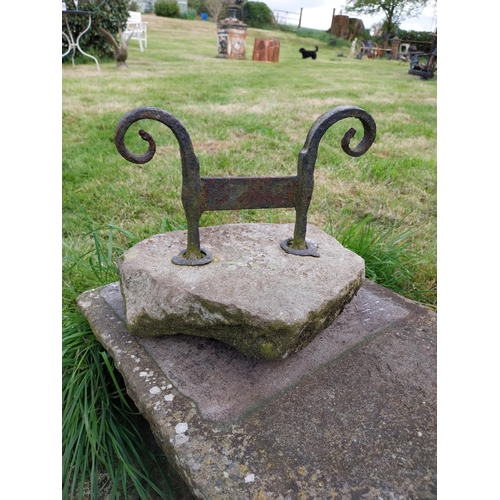 743 - Wrought iron boot pull mounted on stone base {32 cm H x 30 cm W x 24 cm D}.