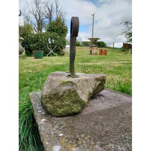 743 - Wrought iron boot pull mounted on stone base {32 cm H x 30 cm W x 24 cm D}.