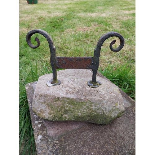 743 - Wrought iron boot pull mounted on stone base {32 cm H x 30 cm W x 24 cm D}.