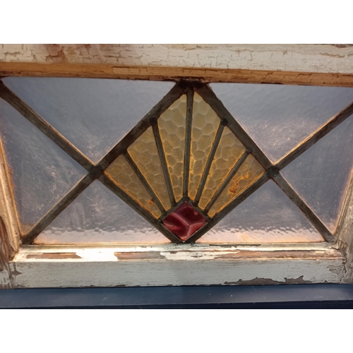 750 - Leaded stain glass window with red centre {H 41cm x W 69cm }. (NOT AVAILABLE TO VIEW IN PERSON)