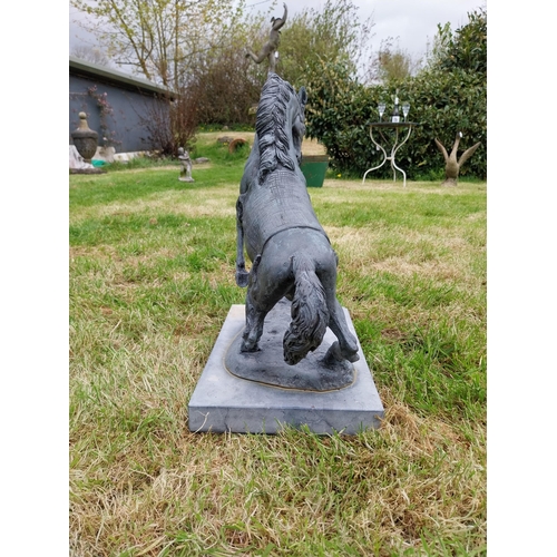 757 - Bronze sculpture of a rearing Horse mounted on slate base {52 cm H x 41 cm W x 26 cm D}.