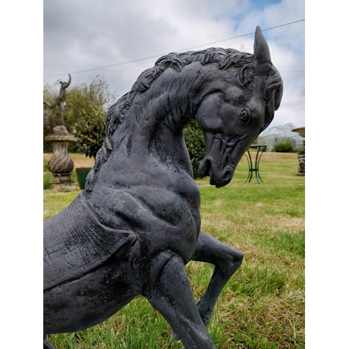 757 - Bronze sculpture of a rearing Horse mounted on slate base {52 cm H x 41 cm W x 26 cm D}.