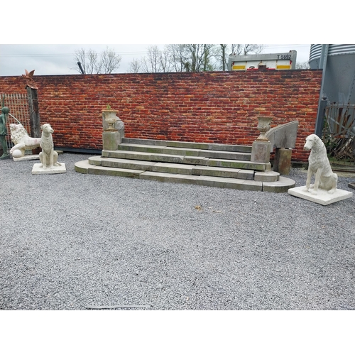 766 - Pair of good quality moulded sandstone statues of Irish Wolf Hounds mounted on platform base {119 cm... 