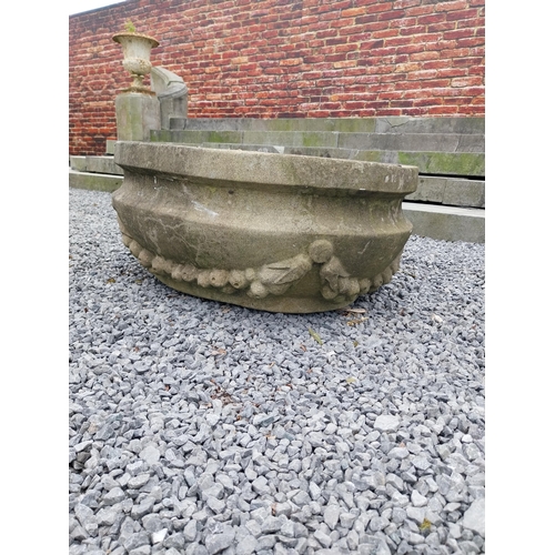 795 - Good quality carved sandstone planter decorated with swags {37 cm H x 80 cm W x 61 cm D}.