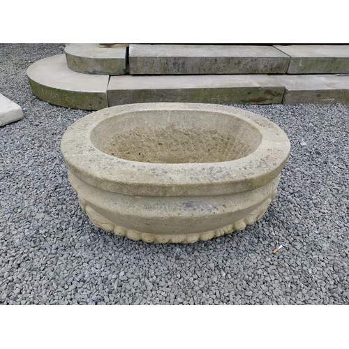 796 - Good quality carved sandstone planter decorated with swags {37 cm H x 80 cm W x 61 cm D}.