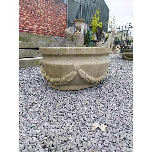 796 - Good quality carved sandstone planter decorated with swags {37 cm H x 80 cm W x 61 cm D}.