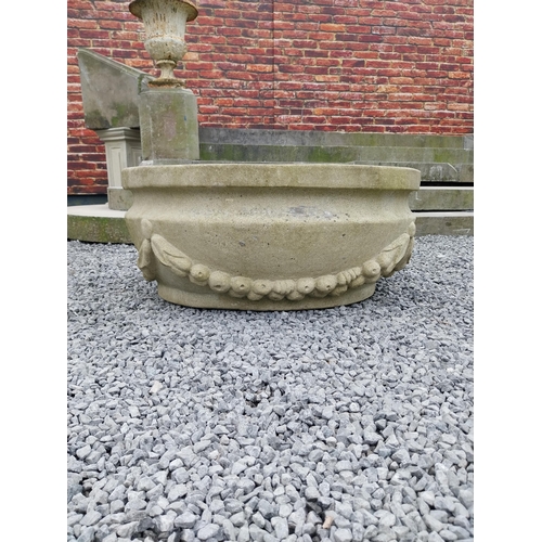 796 - Good quality carved sandstone planter decorated with swags {37 cm H x 80 cm W x 61 cm D}.