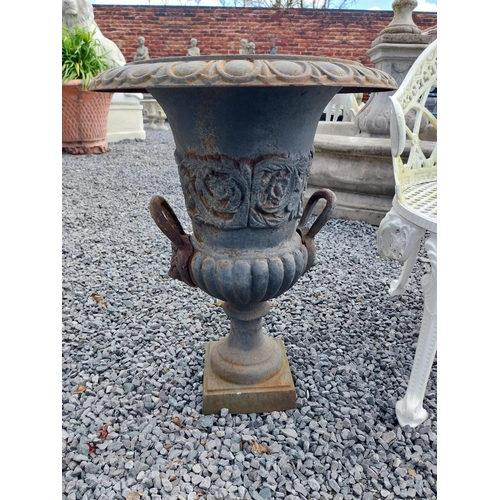 806 - Pair of decorative cast iron urns with lions mask handles {64 cm H x 67 cm Dia.}.