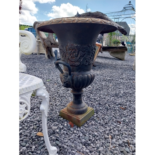 806 - Pair of decorative cast iron urns with lions mask handles {64 cm H x 67 cm Dia.}.