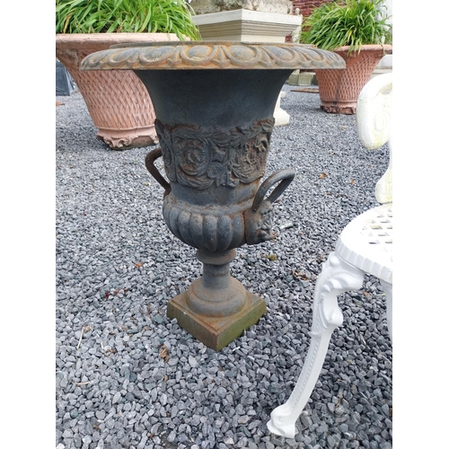 806 - Pair of decorative cast iron urns with lions mask handles {64 cm H x 67 cm Dia.}.