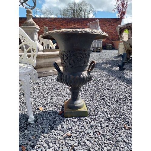 806 - Pair of decorative cast iron urns with lions mask handles {64 cm H x 67 cm Dia.}.