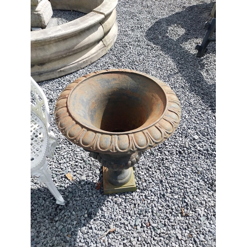 806 - Pair of decorative cast iron urns with lions mask handles {64 cm H x 67 cm Dia.}.