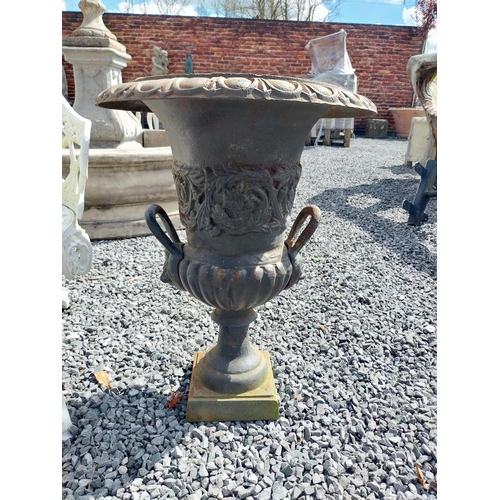 806 - Pair of decorative cast iron urns with lions mask handles {64 cm H x 67 cm Dia.}.