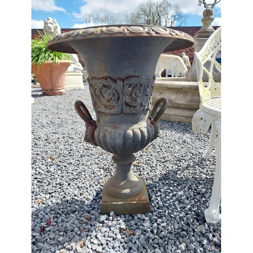 806 - Pair of decorative cast iron urns with lions mask handles {64 cm H x 67 cm Dia.}.