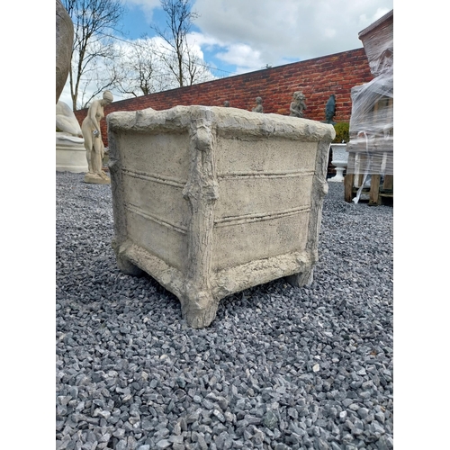 810 - Pair of moulded sandstone planters in the form of tree branches {57 cm H x 56 cm W x 56 cm D}.