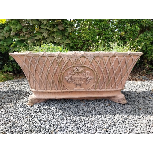 84 - Moulded terracotta rectangular lattice planters on Lions feet {52 cm H x 114 cm W x 56 cm D}.