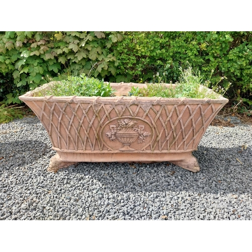 84 - Moulded terracotta rectangular lattice planters on Lions feet {52 cm H x 114 cm W x 56 cm D}.