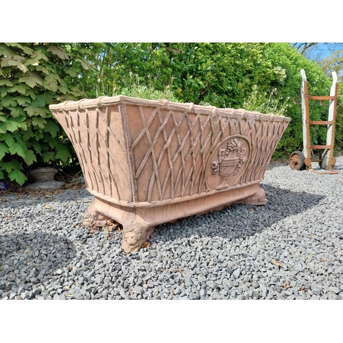 84 - Moulded terracotta rectangular lattice planters on Lions feet {52 cm H x 114 cm W x 56 cm D}.