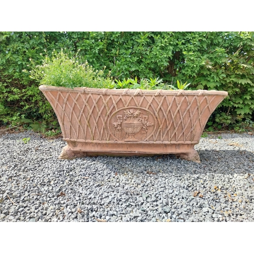 85 - Moulded terracotta rectangular lattice planters on Lions feet {52 cm H x 114 cm W x 56 cm D}.