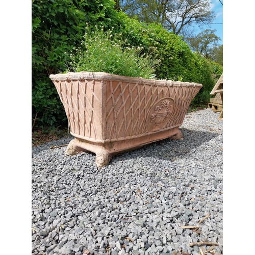 85 - Moulded terracotta rectangular lattice planters on Lions feet {52 cm H x 114 cm W x 56 cm D}.