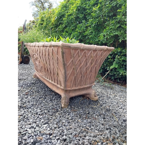 85 - Moulded terracotta rectangular lattice planters on Lions feet {52 cm H x 114 cm W x 56 cm D}.