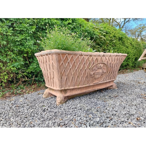 85 - Moulded terracotta rectangular lattice planters on Lions feet {52 cm H x 114 cm W x 56 cm D}.