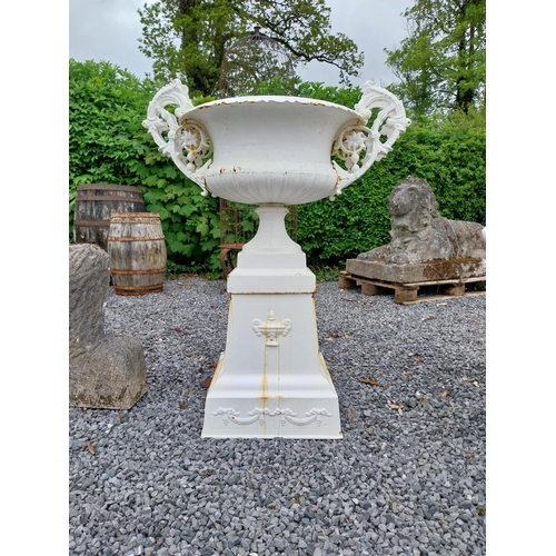 889 - Decorative French cast iron urn raised on pedestal {109 cm H x 86 cm W x 60 cm D}.