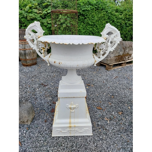 889 - Decorative French cast iron urn raised on pedestal {109 cm H x 86 cm W x 60 cm D}.