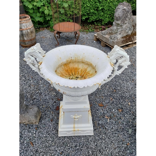 889 - Decorative French cast iron urn raised on pedestal {109 cm H x 86 cm W x 60 cm D}.