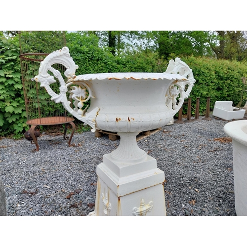 889 - Decorative French cast iron urn raised on pedestal {109 cm H x 86 cm W x 60 cm D}.