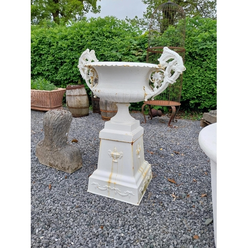 889 - Decorative French cast iron urn raised on pedestal {109 cm H x 86 cm W x 60 cm D}.