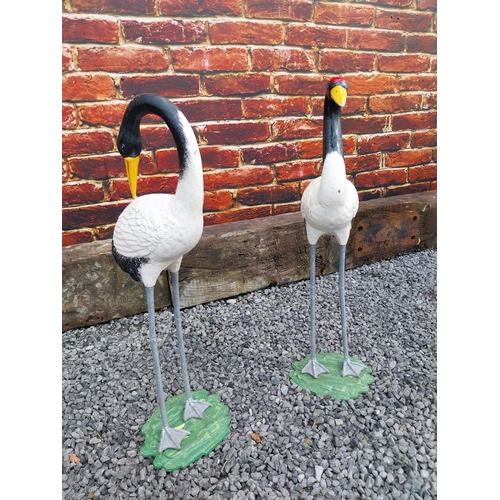 908 - Pair of cast iron statues of Cranes {76 cm H x 24 cm W x 20 cm D and 75 cm H x 23 cm W x 19 cm D}.