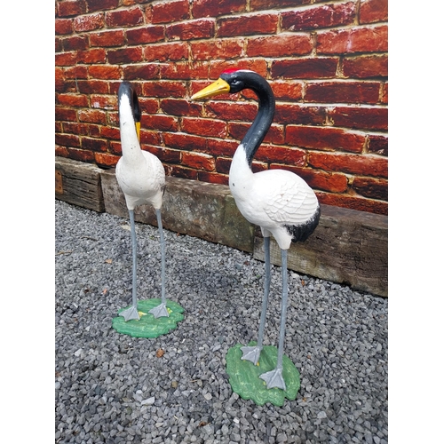 908 - Pair of cast iron statues of Cranes {76 cm H x 24 cm W x 20 cm D and 75 cm H x 23 cm W x 19 cm D}.