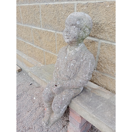 915 - Stone statue of a Boy sitting {H 70cm x W 26cm x D 30cm }. (NOT AVAILABLE TO VIEW IN PERSON)