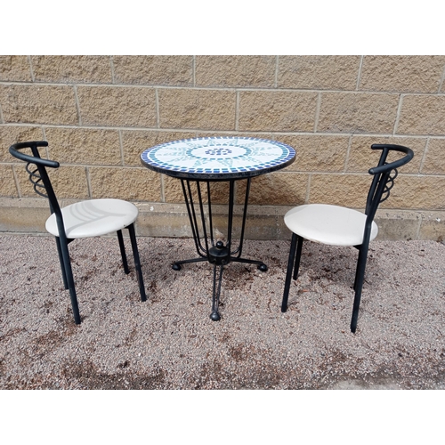 934 - Cast iron table mosaic top and two metal chairs with leather seats {Table H 72cm x Dia 70cm Chairs H... 