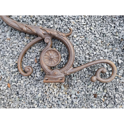 936 - Pair of decorative cast iron wall light brackets {70 cm W x 60 cm D}.