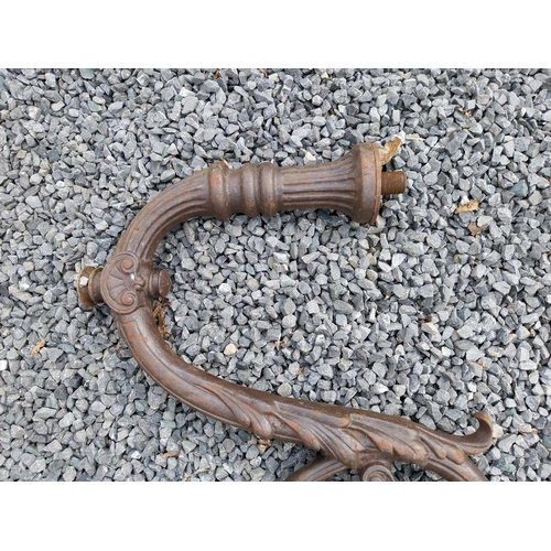 936 - Pair of decorative cast iron wall light brackets {70 cm W x 60 cm D}.