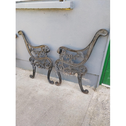 940 - Pair of decorative cast iron seat ends {74 cm H x 66 cm W}.