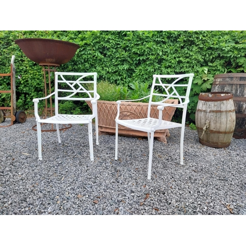 943 - Pair of cast aluminium garden chairs {84 cm H x 58 cm W x 45 cm D}.