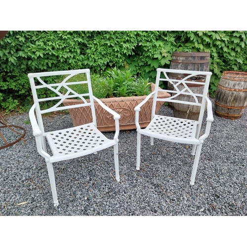 943 - Pair of cast aluminium garden chairs {84 cm H x 58 cm W x 45 cm D}.