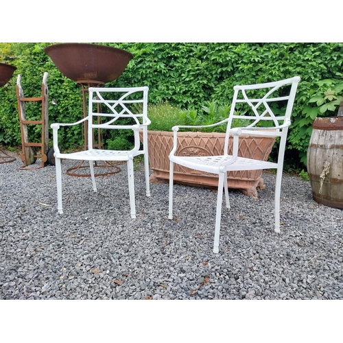 943 - Pair of cast aluminium garden chairs {84 cm H x 58 cm W x 45 cm D}.