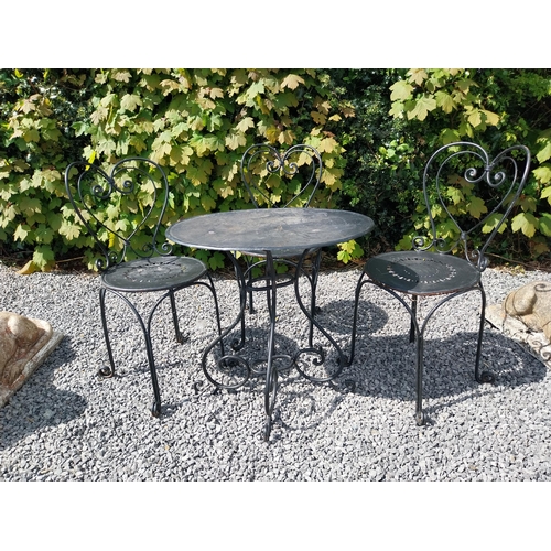 951 - Wrought iron garden table with three matching chairs {Tbl. 65 cm H x 65 cm Dia. and Chairs 82 cm H x... 