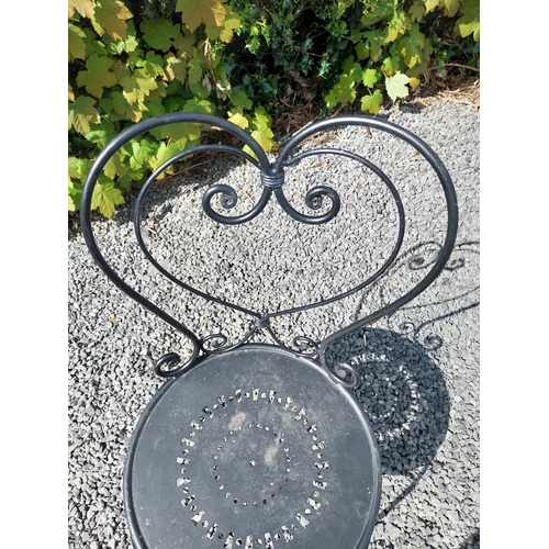 951 - Wrought iron garden table with three matching chairs {Tbl. 65 cm H x 65 cm Dia. and Chairs 82 cm H x... 